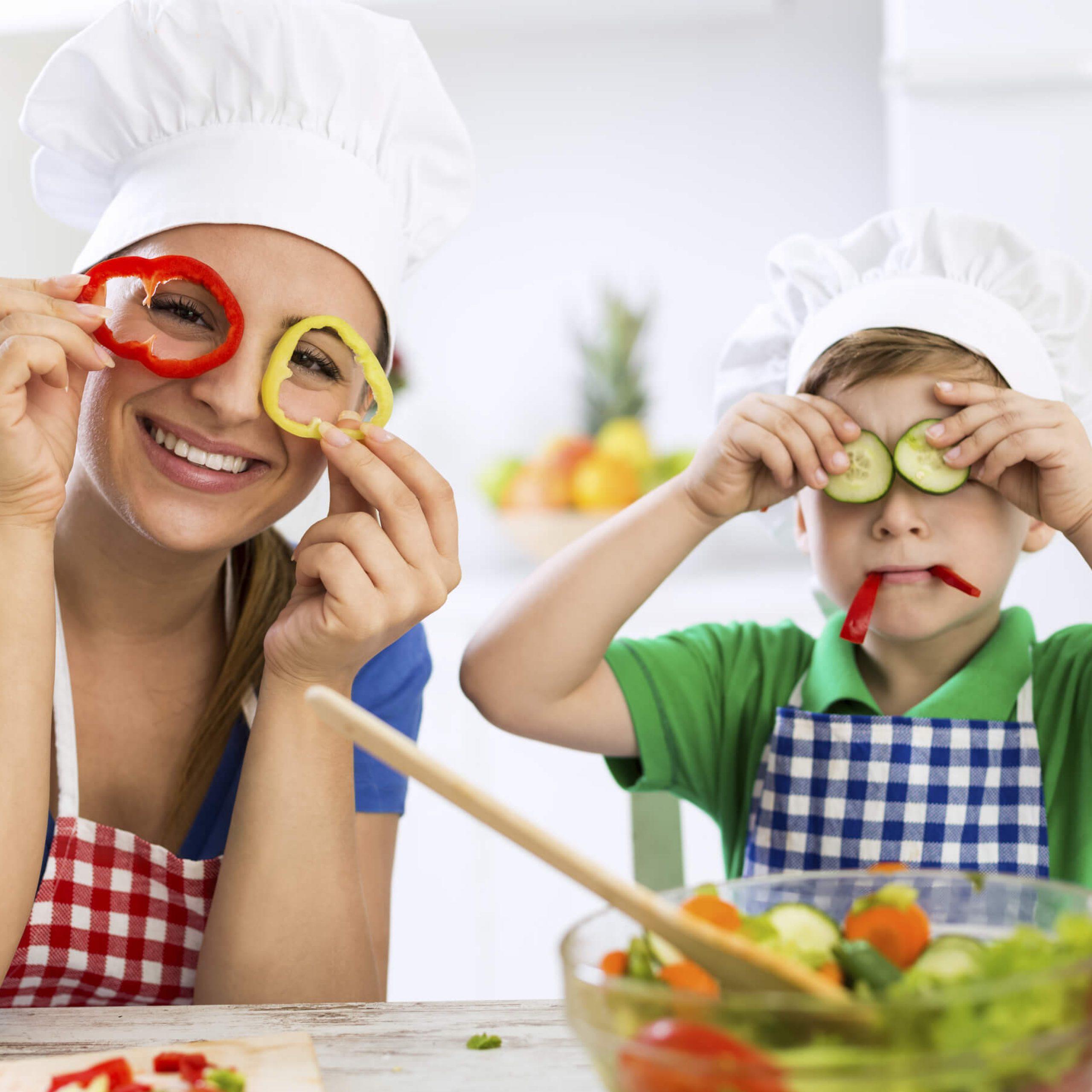 A joyful child enjoying a plate of colourful fruits and vegetables, showcasing the pleasure of kids' healthy eating.